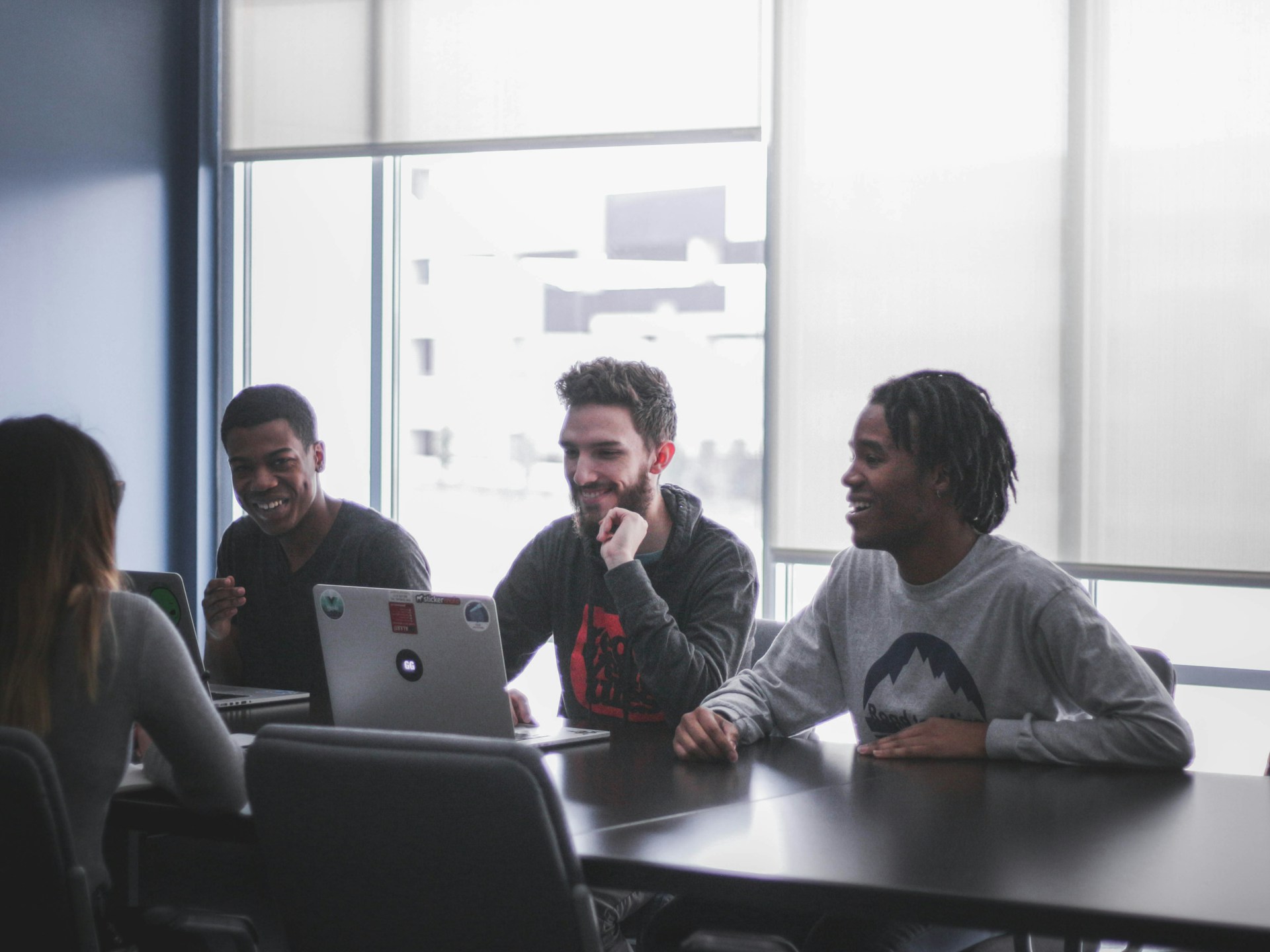 A marketing team sharing ideas around a table