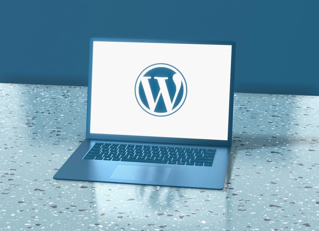 WordPress logo on a laptop screen